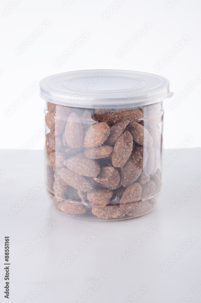 Almond in jar on background Almond in jar on background