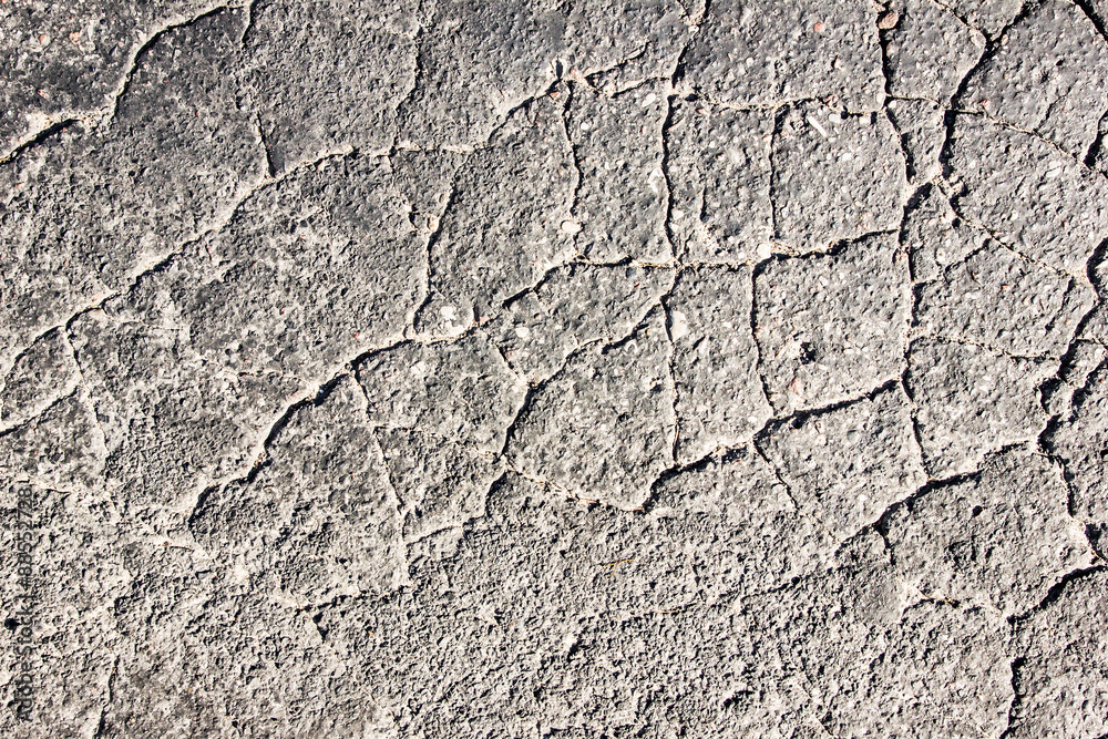 Cracked asphalt grunge texture. Cracked asphalt grunge texture.