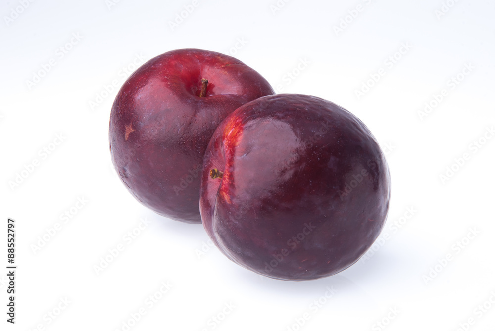 Plum. Ripe plum fruit on background