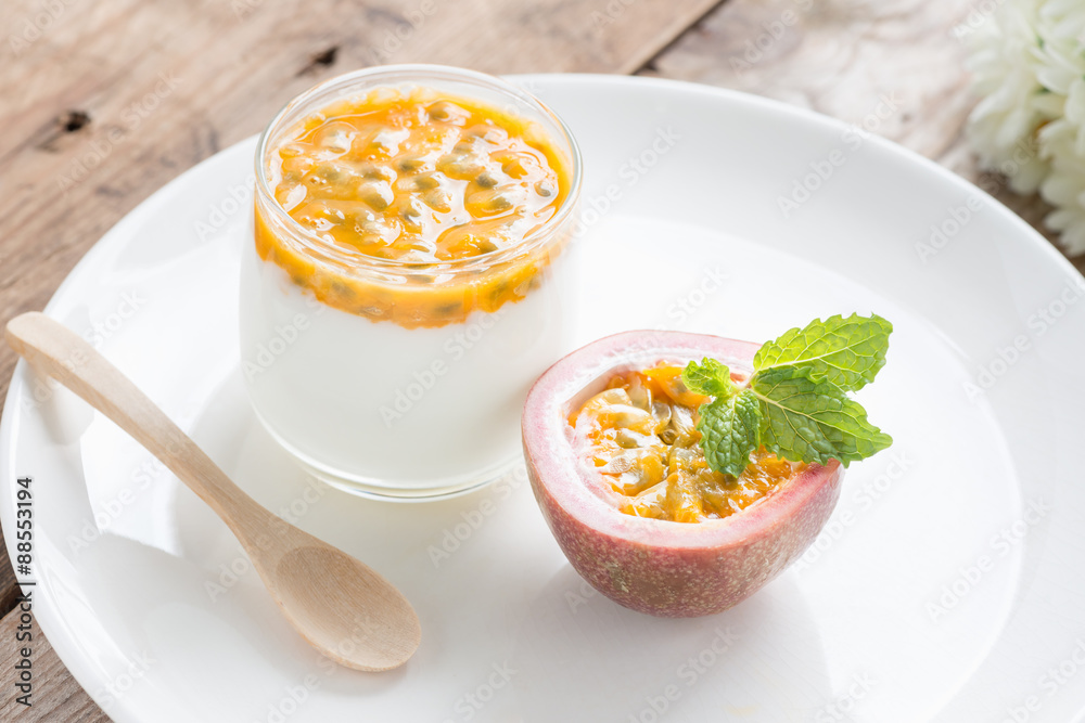 Yogurt with passion fruit on white plate. Yogurt with passion fruit on white plate.