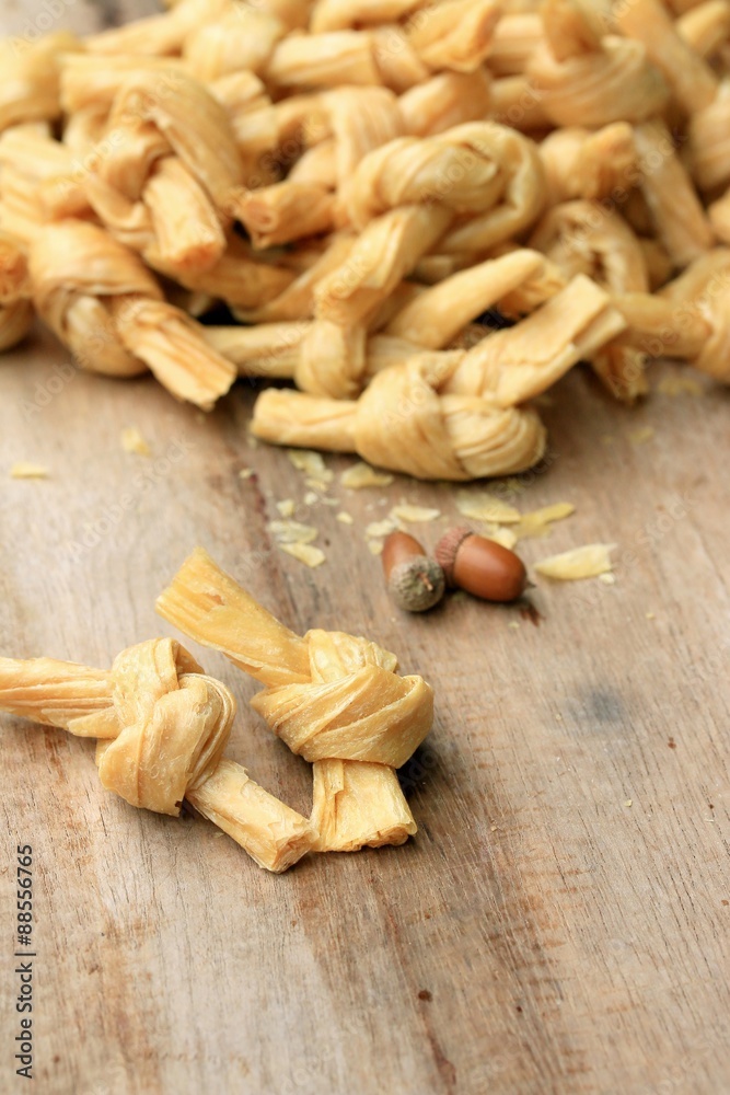 Fototapeta premium dried bean curd on wood vintage