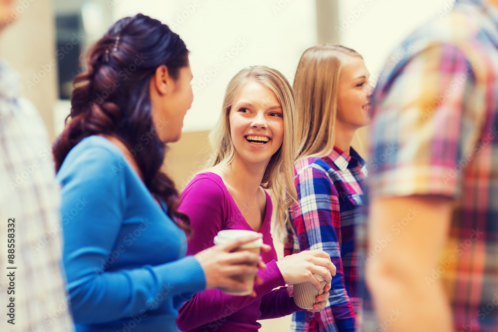 group of smiling students with paper coffee cups group of smiling students with paper coffee cups