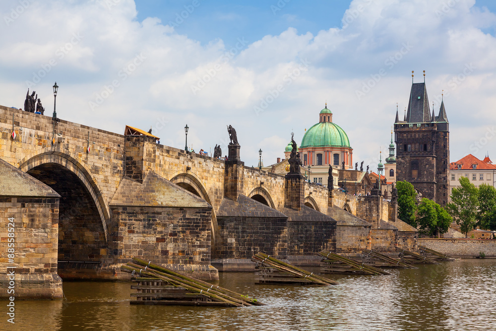 Charles Bridge in Prague with tower and church