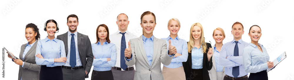 group of happy businesspeople showing thumbs up group of happy businesspeople showing thumbs up