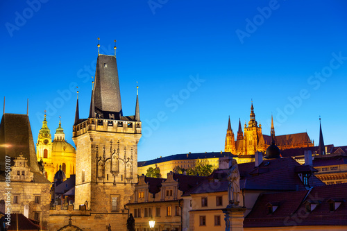 Twilight scene of Prague with Charles bridge tower and St Vitus