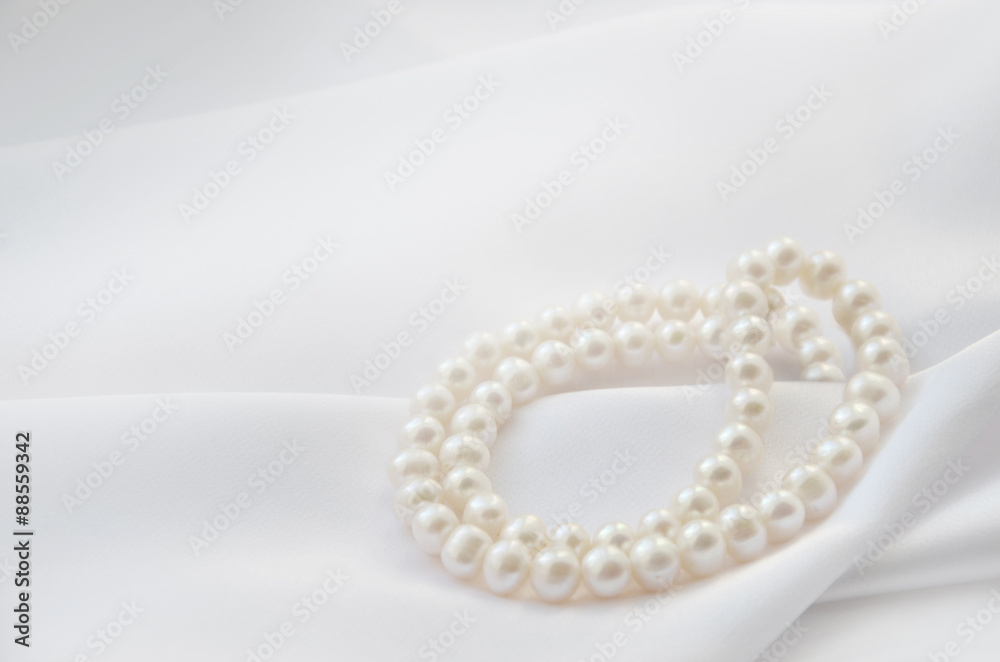 Elegant white background with lace, silk and pearl Elegant white background with lace, silk and pearl