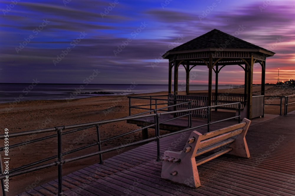 Sunset view of a ocean shore and gazebo