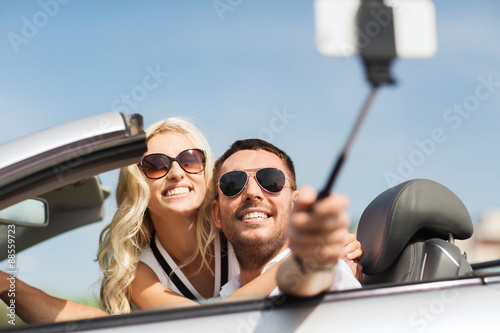 happy couple in car taking selfie with smartphone © Syda Productions