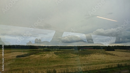 Train window reflection of landscape outside of Karlstad