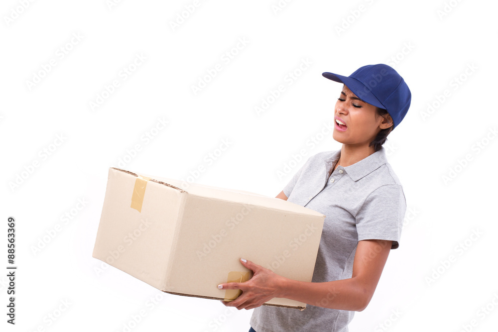 female delivery staff carrying heavy parcel carton box female delivery staff carrying heavy parcel carton box