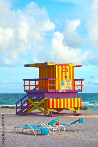 Miami Beach Florida, USA famous tropical travel location, typical Art Deco lifeguard house on a beautiful summer afternoon with ocean and blue sky