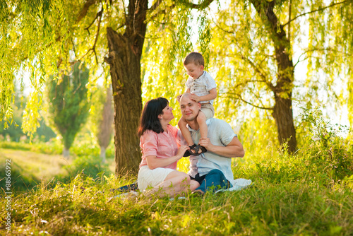 Happy joyful young family with child