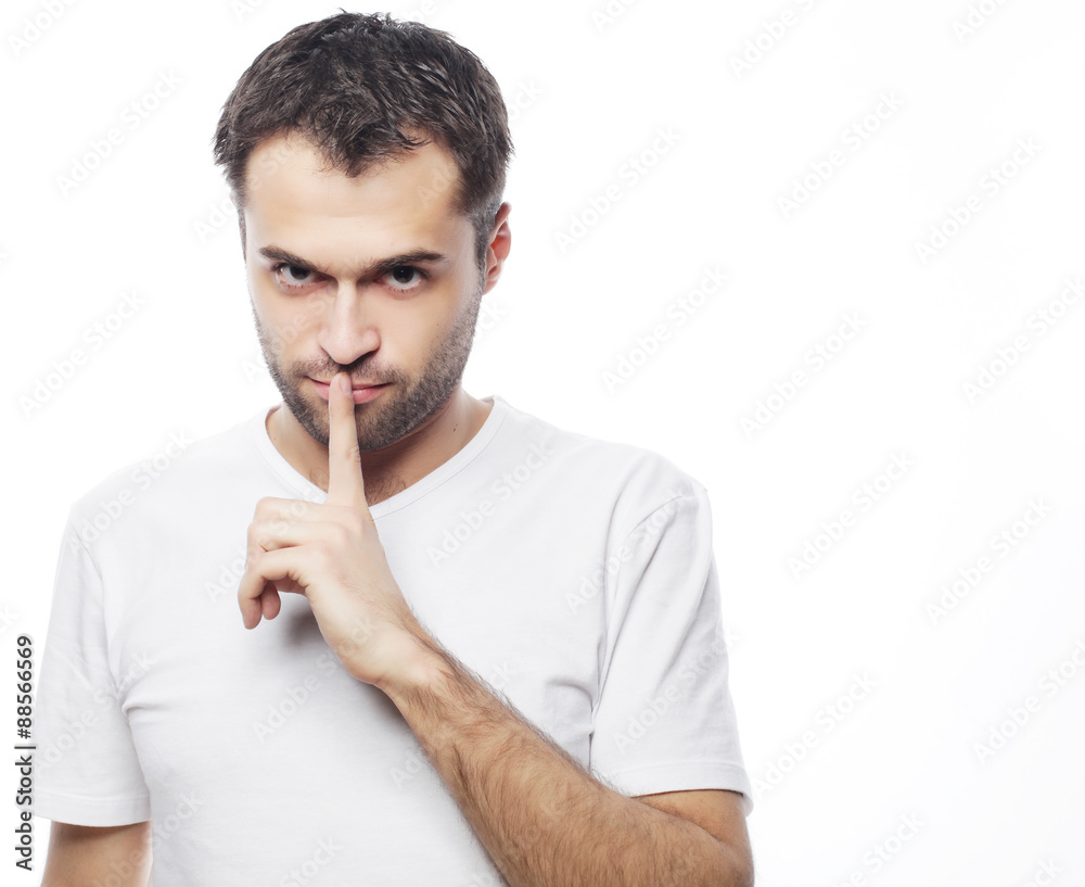 young man making silence gesture, shhhhh!! young man making silence gesture, shhhhh!!