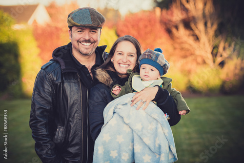 Young chilean family at the garden.
