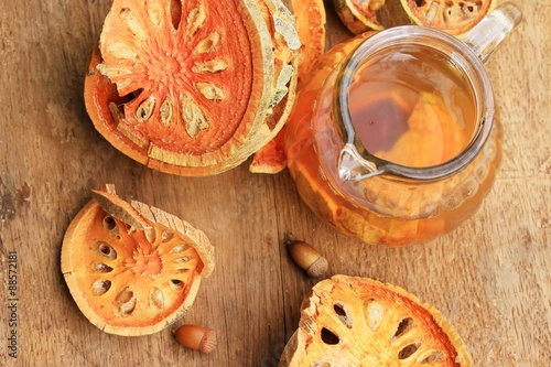 Slices of dried bael fruit and juice
