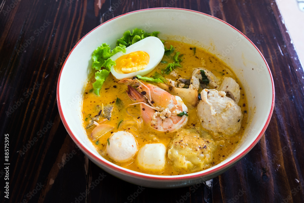 Asian noodle with seafood and egg in the tomyum soup