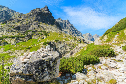 Hiking trail to Starolesna valley in High Tatra Mountains on sunny summer day, Slovakia