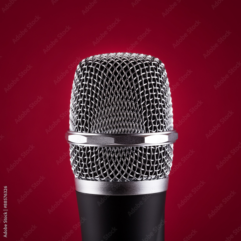 Wireless microphone on red background Wireless microphone on red background