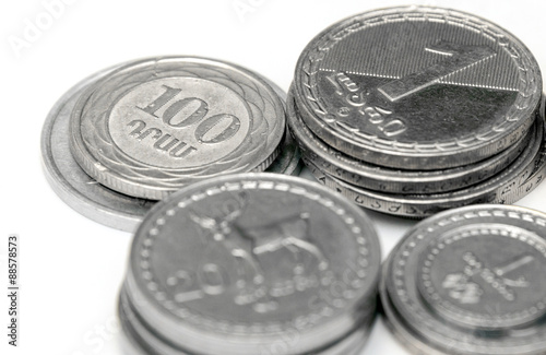 Stacks of Russian, Georgian and Armenian coins on a white background