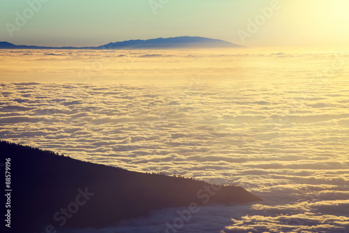 Aerial view over clouds above ocean water with last sunshine  Tenerife  Canary Islands  Spain