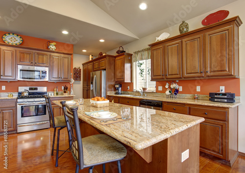 American traditional kitchen with glossy hardwood floor.