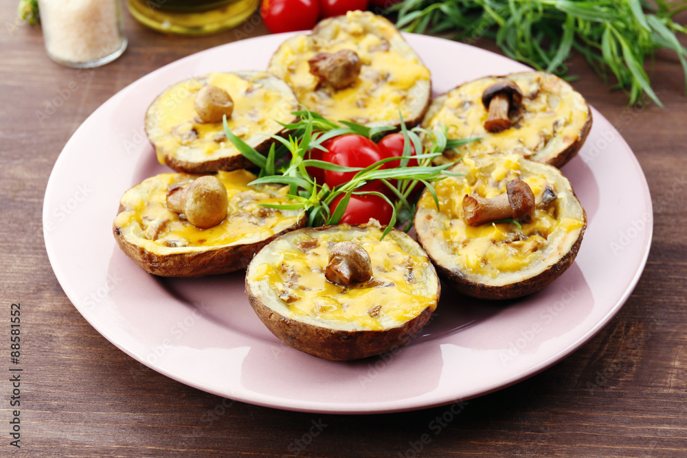Baked potatoes with cheese and mushrooms on table close up
