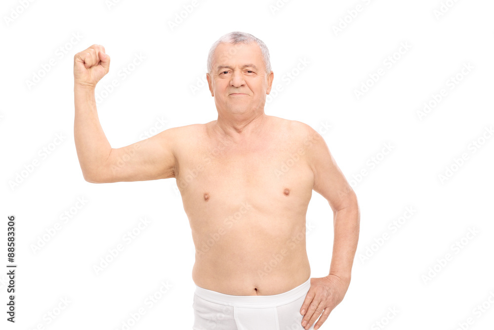 Senior man wearing nothing but underwear and showing his bicep Senior man wearing nothing but underwear and showing his bicep