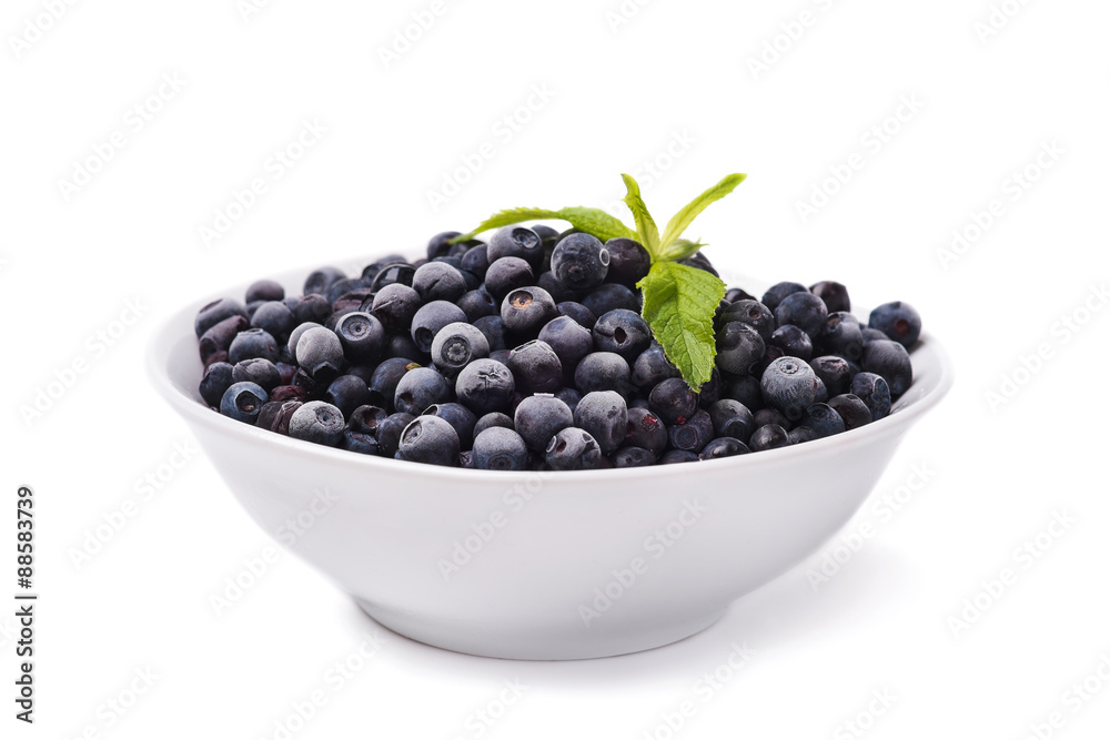 Plate with frozen blueberries on a white background Plate with frozen blueberries on a white background