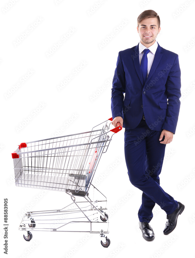 Young man with empty shopping cart, isolated on white Young man with empty shopping cart, isolated on white