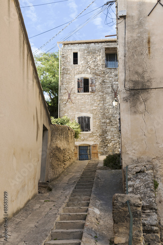 Fototapeta Naklejka Na Ścianę i Meble -  narrow street with staircase in an old village in southern Europ