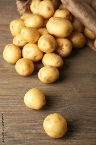 New potatoes on wooden background