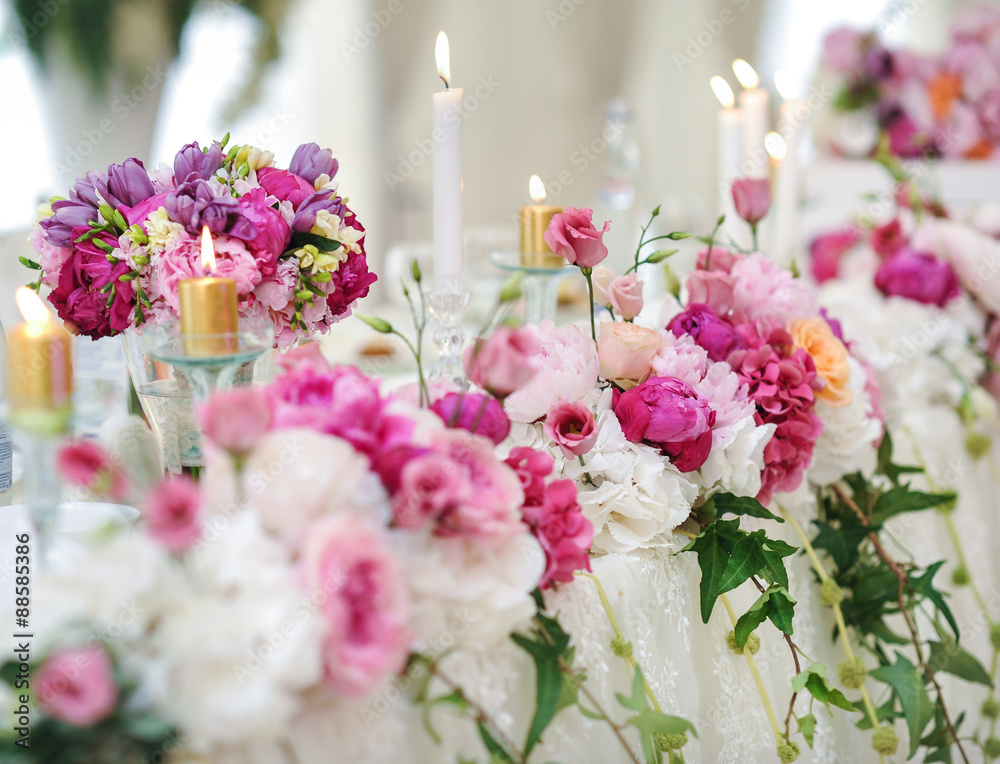 Arrangement of pink and white flowers in restaurant for luxury wedding event Arrangement of pink and white flowers in restaurant for luxury wedding event