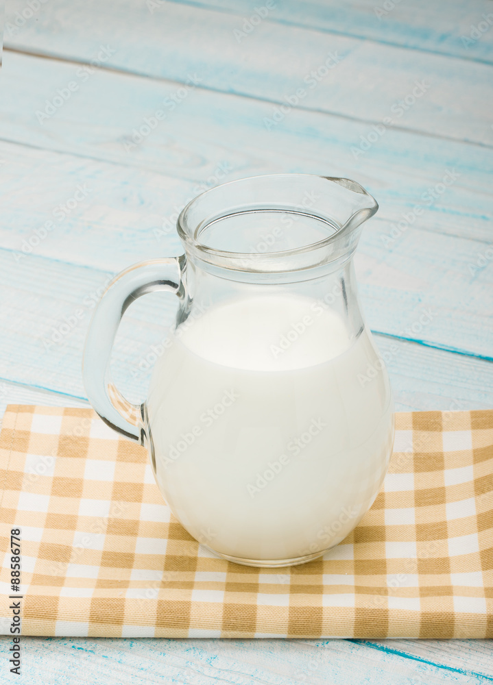 jug of milk on a yellow checkered tablecloth jug of milk on a yellow checkered tablecloth