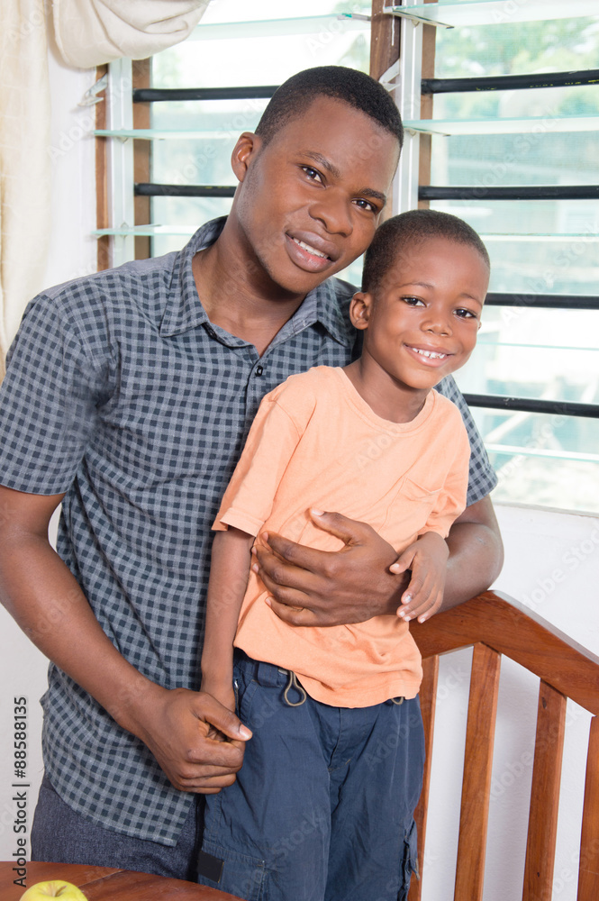 Happy father with his son takes a picture together. Happy father with his son takes a picture together.