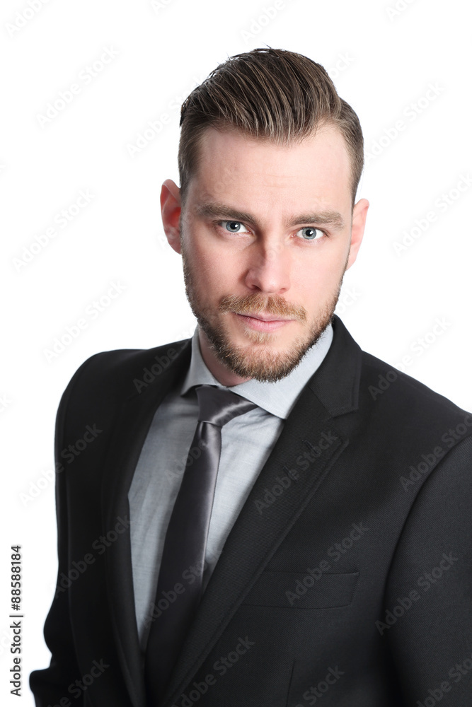 Attractive businessman in his 20s wearing a black suit with an black tie Attractive businessman in his 20s wearing a black suit with an black tie
