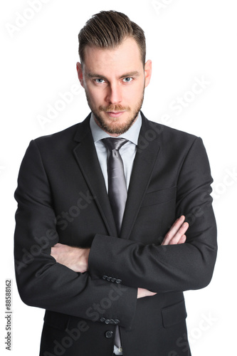 Attractive businessman in his 20s wearing a black suit with an black tie