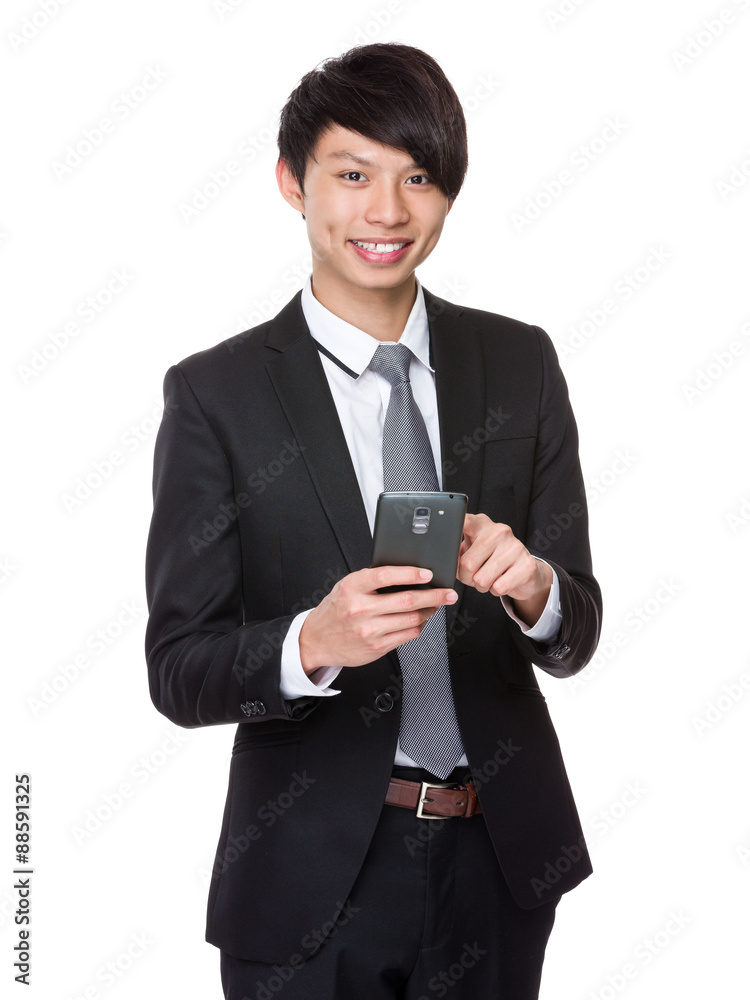 Young businessman use of the cellphone Young businessman use of the cellphone