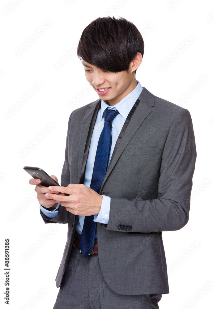 Asian businessman read on the cellphone Asian businessman read on the cellphone