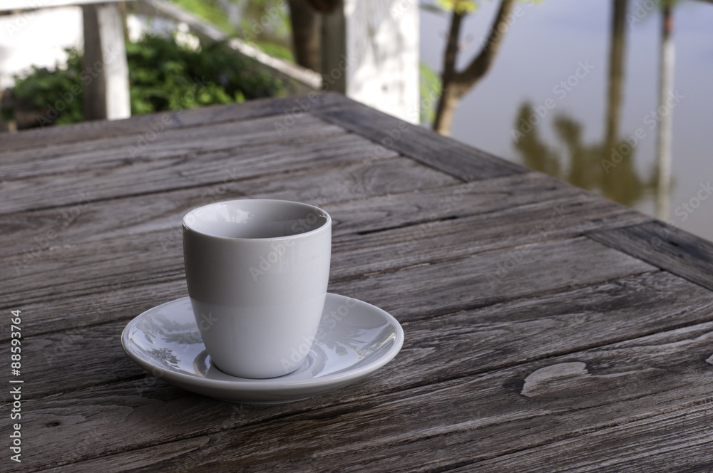 cup of coffee on wood background