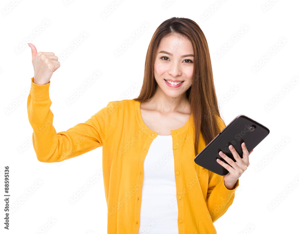Asian woman hold with digital tablet and thumb up Asian woman hold with digital tablet and thumb up