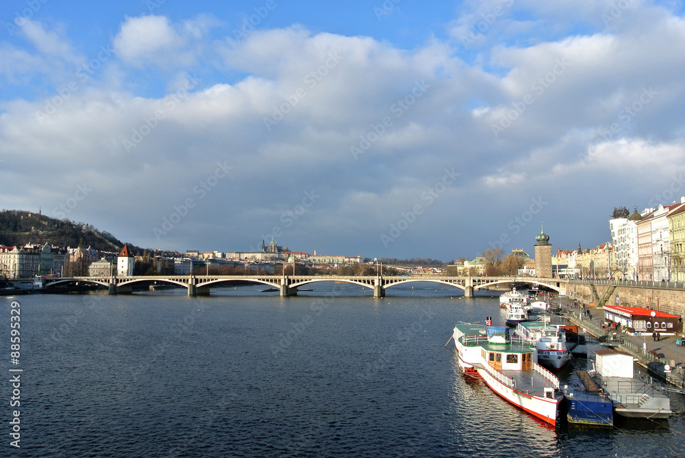 View on the bridges in Prague and Vltava river on a clear, sunny, afternoon. Urban landscape; cityscape.