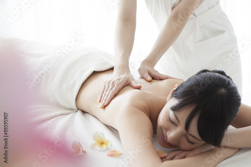 Young women receiving a massage at the spa