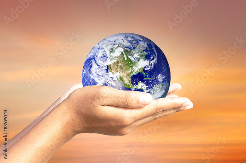 We love the world of ideas.world in human hands. Natural background blur. Elements of this image furnished by NASA.