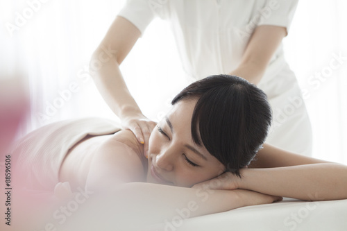 Women receiving comfortably a back massage