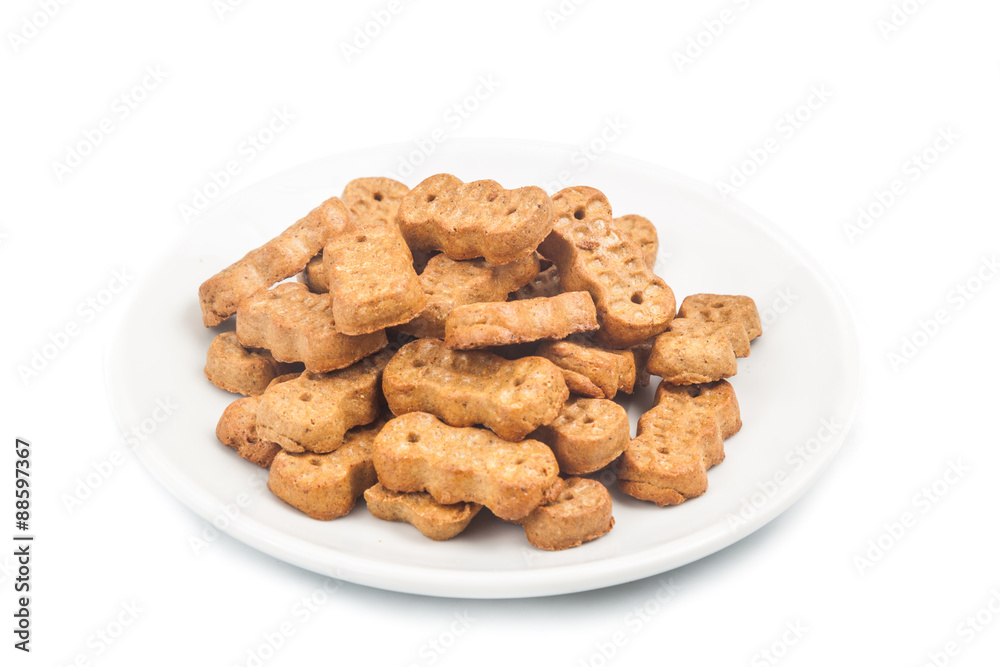 Groundnut shaped biscuit on plate isolated in white Groundnut shaped biscuit on plate isolated in white