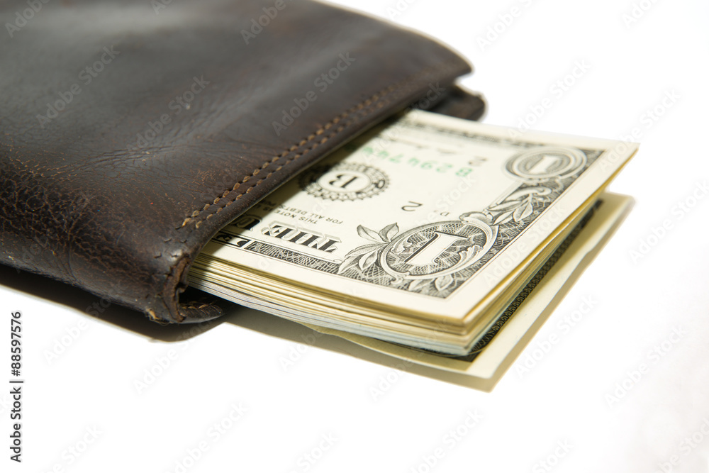 Old wallet with banknotes of US dollars inside Old wallet with banknotes of US dollars inside