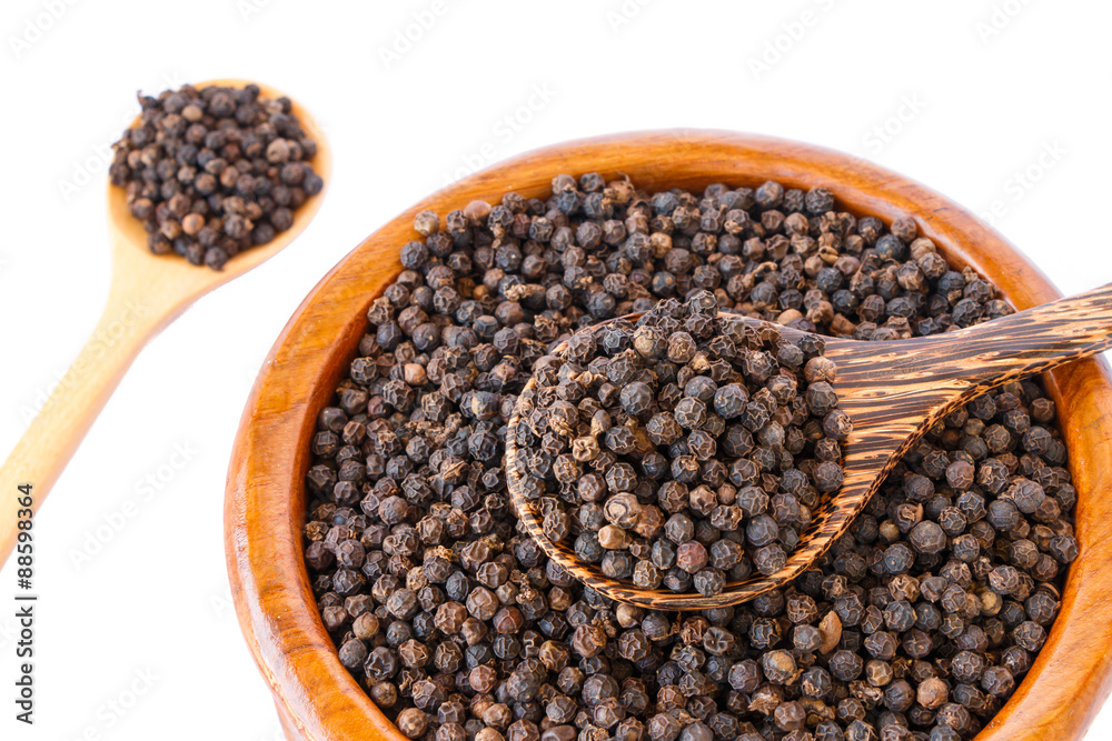 black pepper on wooden spoon with wooden plate isolated on white background. black pepper on wooden spoon with wooden plate isolated on white background.