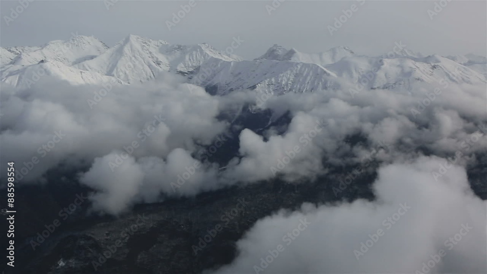 Beautiful mountain peaks of Caucasus Mountains in the clouds Beautiful mountain peaks of Caucasus Mountains in the clouds
