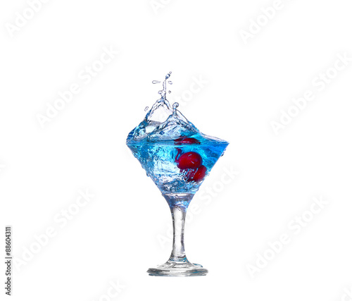 blue cocktail with cherry splash on white