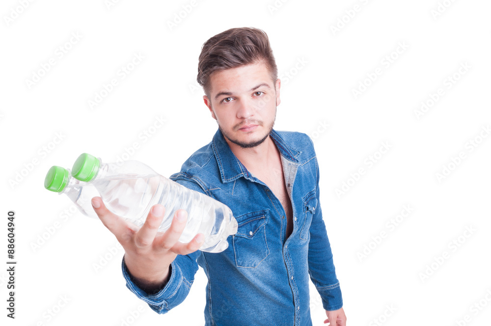 Young handsome man handing two bottles of cold water Young handsome man handing two bottles of cold water